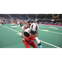 Jacksonville Sharks WR/DB Rob Jones gets wrapped up by the Albany Empire